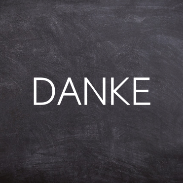 Danke Weiße Schrift auf schwarzer Tafel mit dem Wort "DANKE".